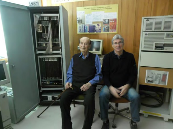 Fig. 5: Professor Ivan Plander at the front of parallel associative SIMD computer, designed by a team of Karol Richter (at the right) at the Museum of Computers in Bratislava. SoRuCom-2020